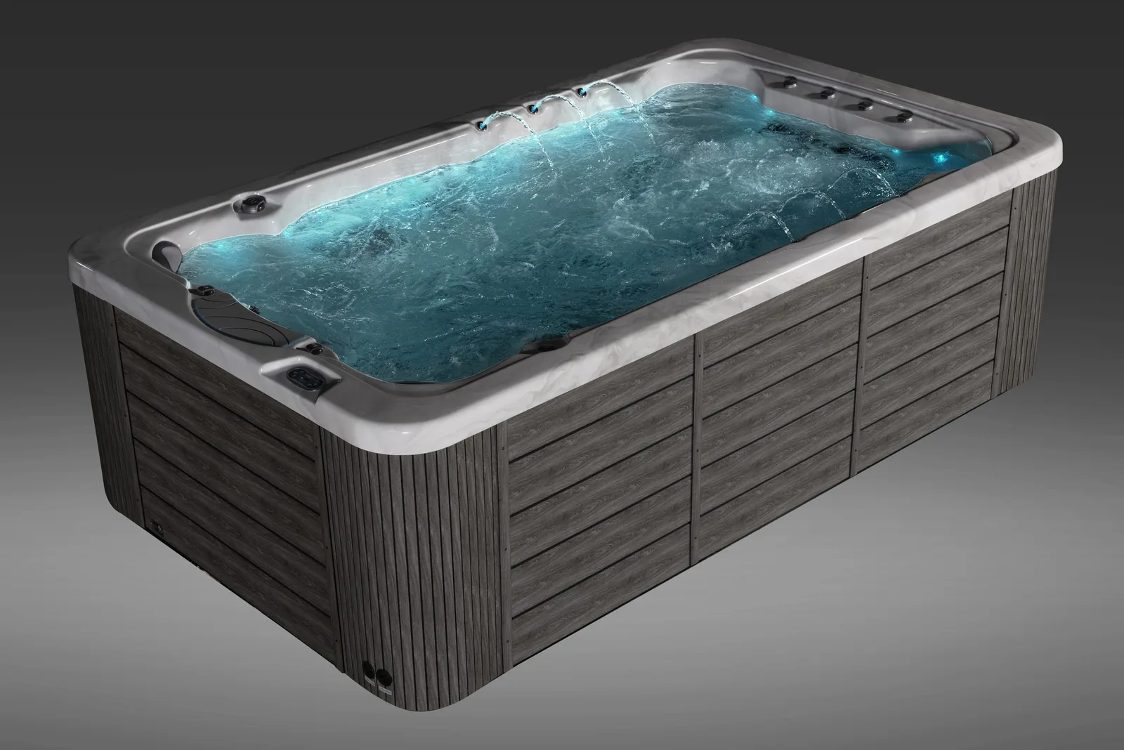 Een complete spa van Icelandic Wellness met bruisend water, verlichte waterstralen en een grijze houtlook-kast