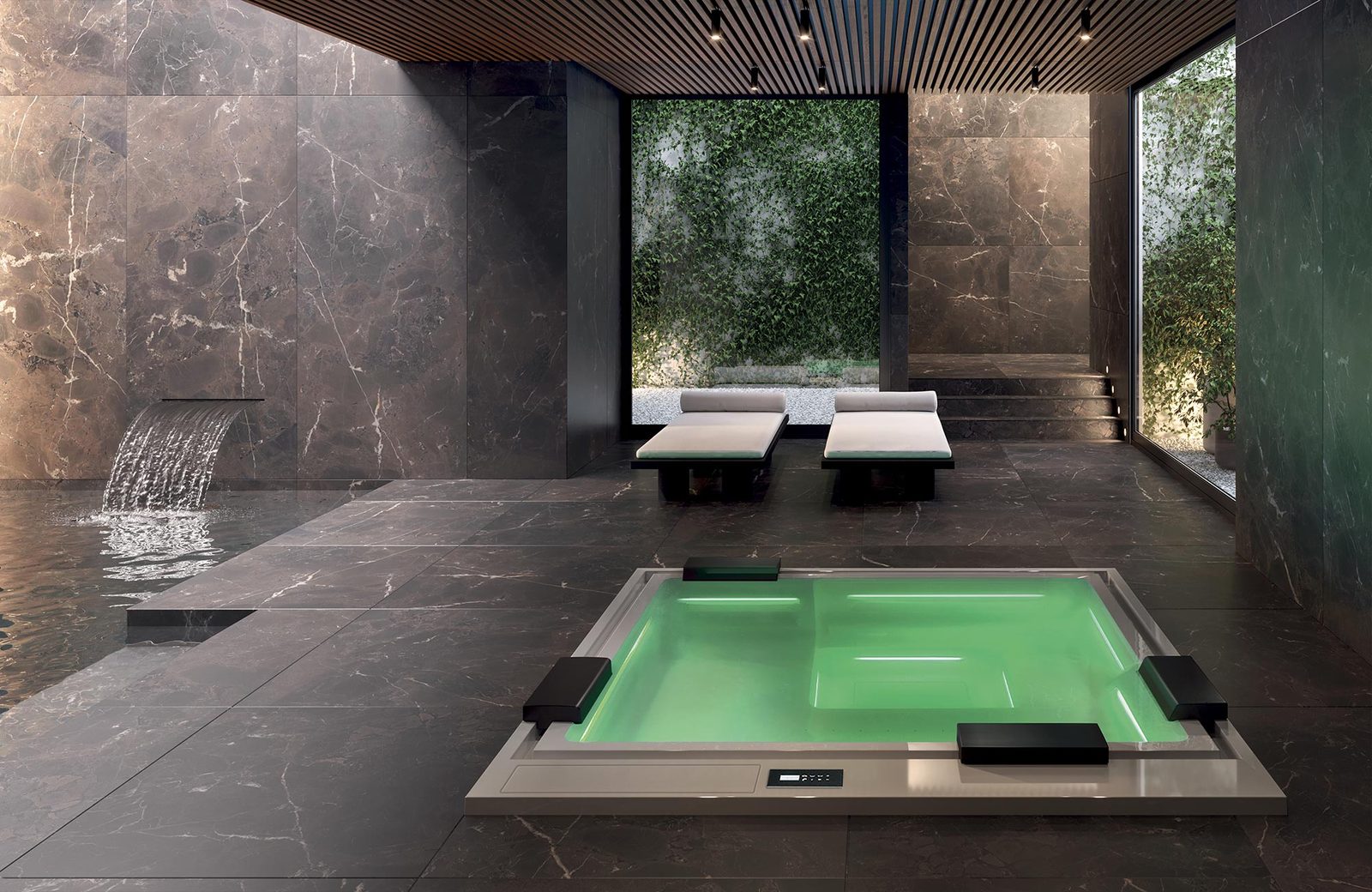 Verzonken spa van Gruppo Treesse, model Phantom, weggewerkt in een marmeren wellnessruimte